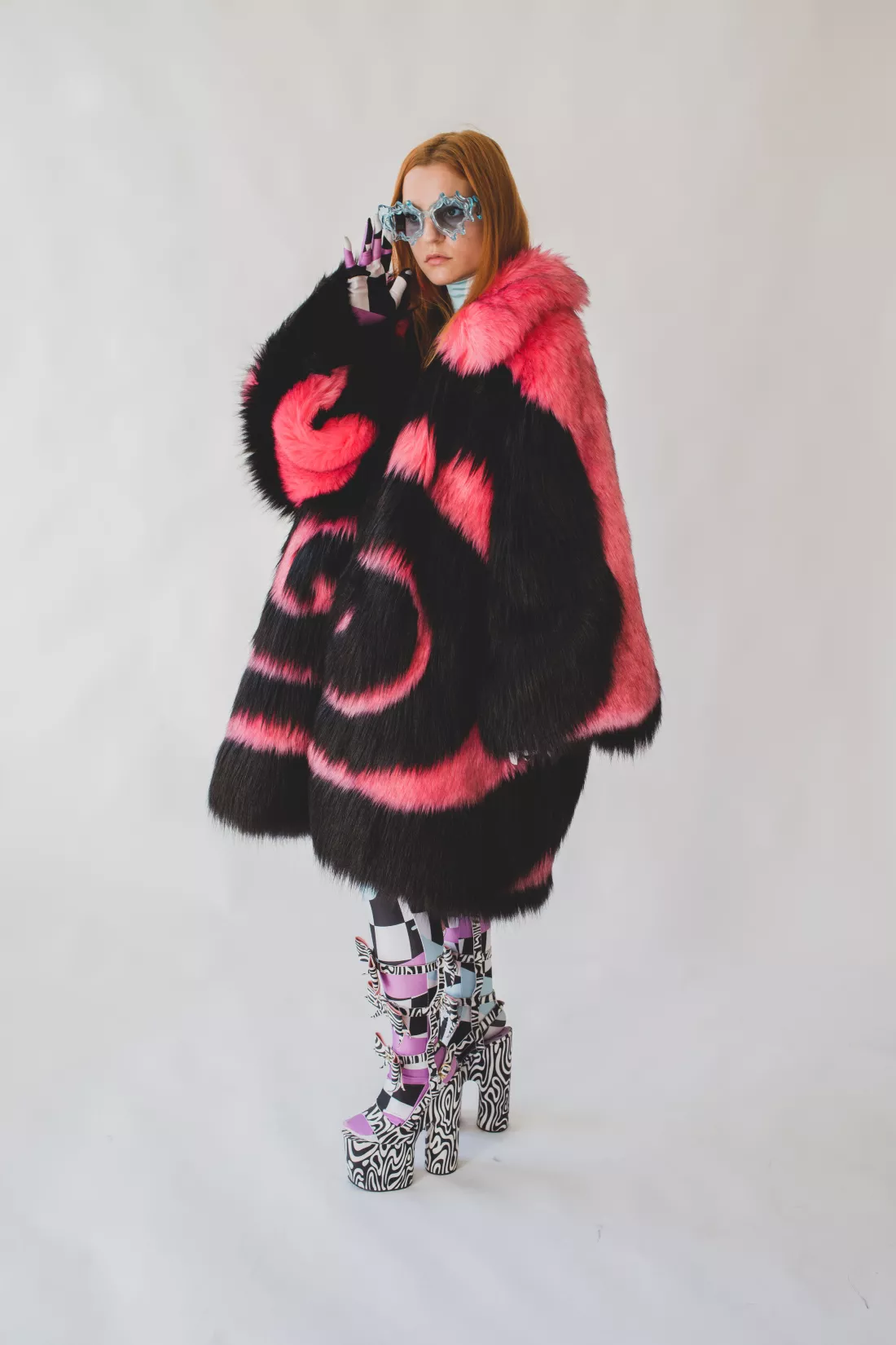 A model wearing the dress, shoes and coat