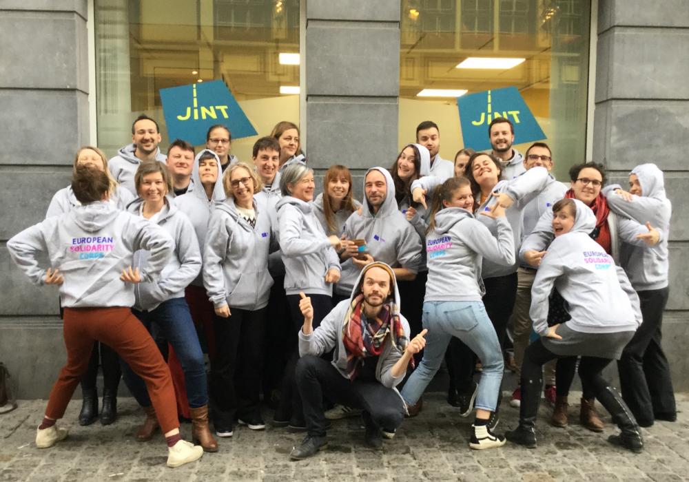 Team in front of JINT with European Solidarity Corps hoodies